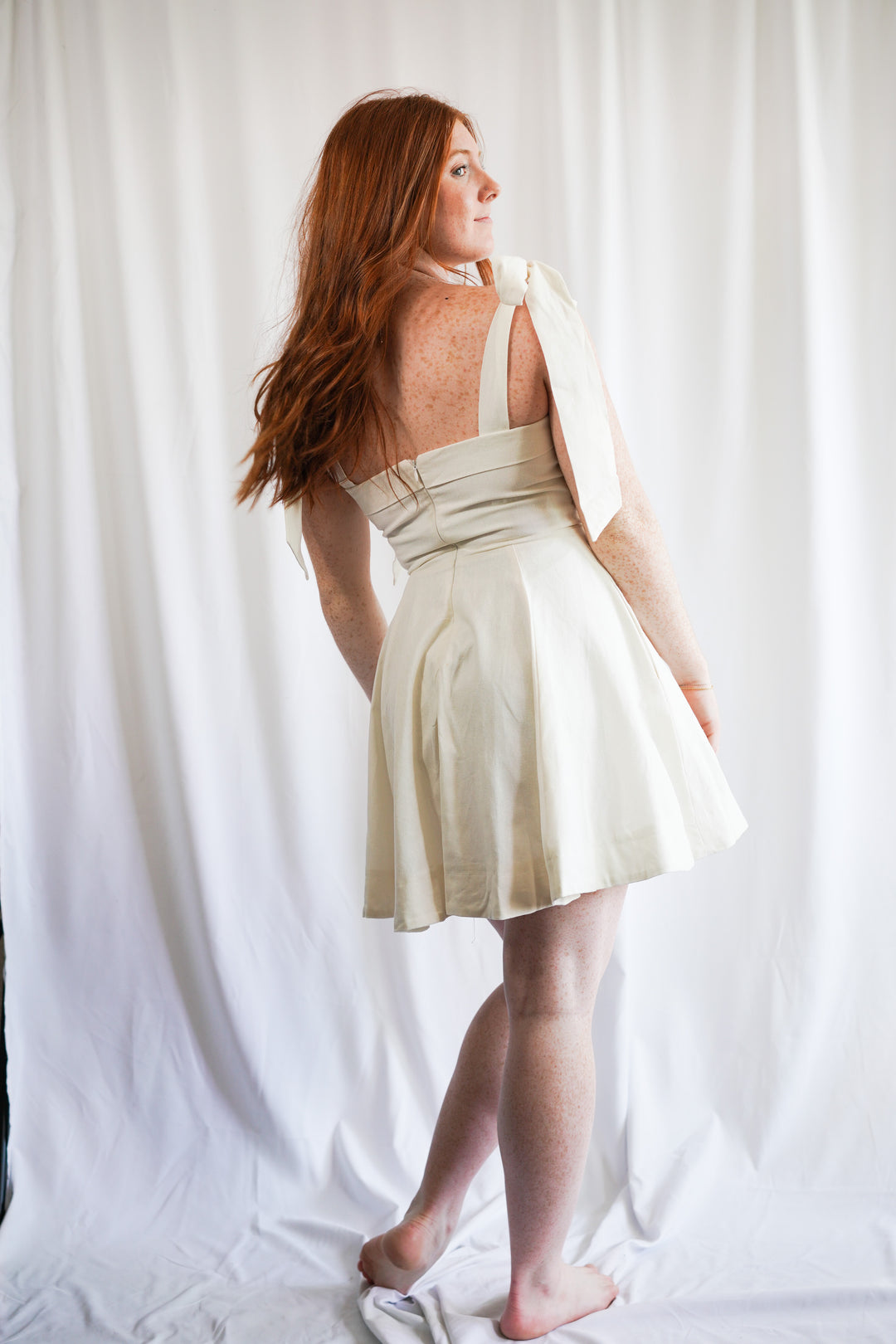 white linen shoulder tie mini dress with pockets